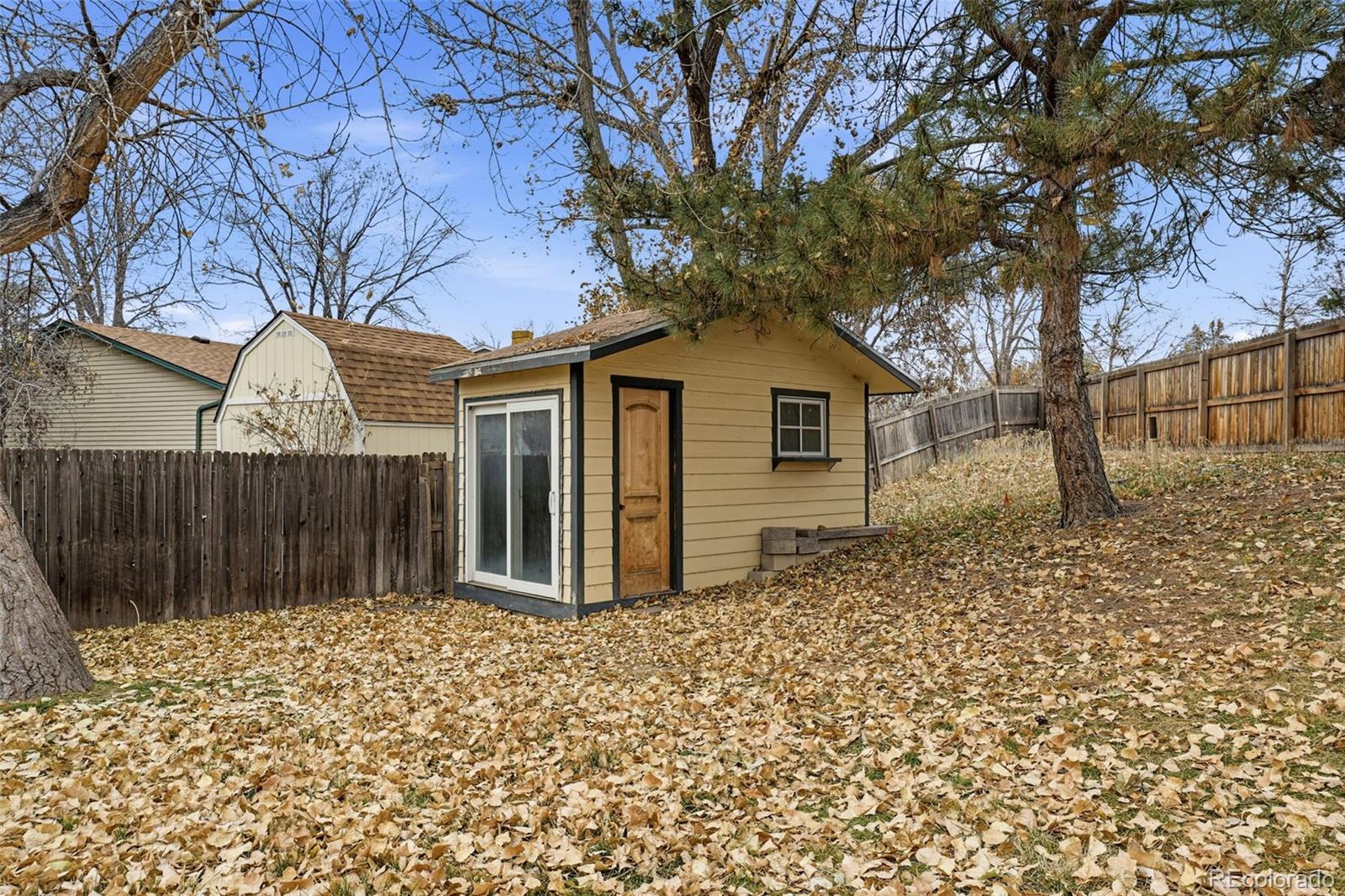 4993 East 111th Place Thornton, CO 80233 - Photo 42 of 50 a front view of a house with a garden