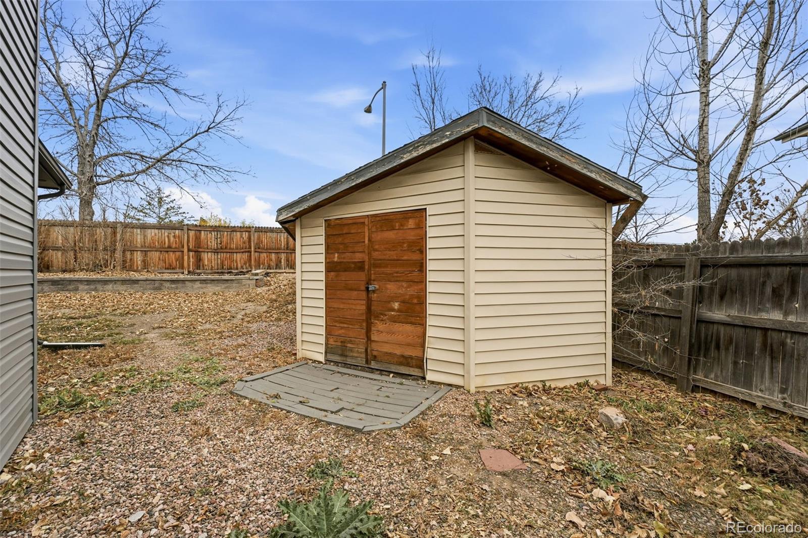 4993 East 111th Place Thornton, CO 80233 - Photo 43 of 50 a view of a house with a yard and garage