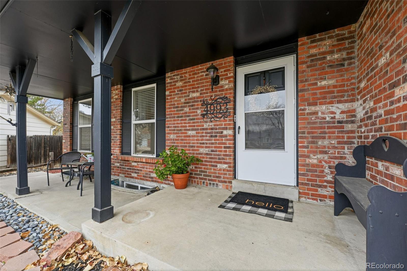 4993 East 111th Place Thornton, CO 80233 - Photo 5 of 50 a backyard of a house with outdoor seating