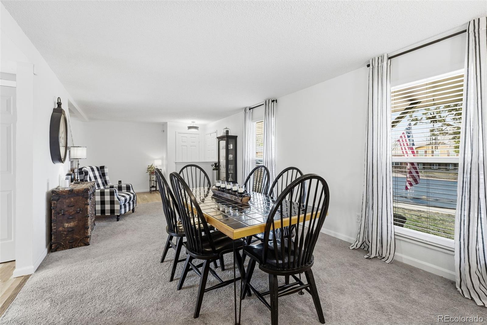 4993 East 111th Place Thornton, CO 80233 - Photo 9 of 50 a view of a a dining room with furniture window and outside view