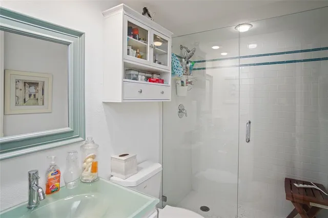 a bathroom with a sink and a shower