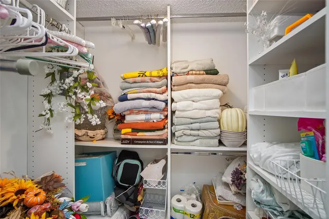 a utility room with multiple dryer and washer
