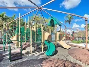 a view of swimming pool with outdoor seating and plants
