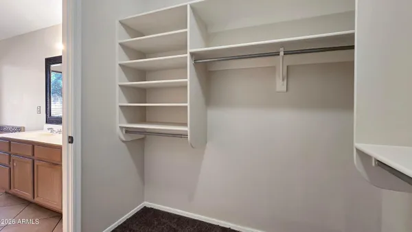 a view of an empty walk in closet