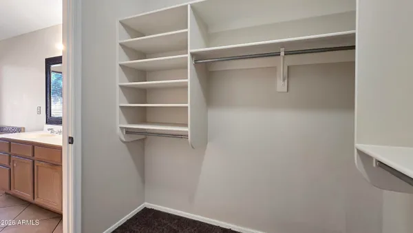a view of an empty walk in closet