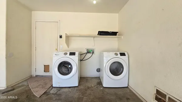 a utility room with dryer and washer