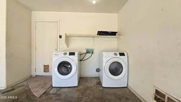 a utility room with dryer and washer