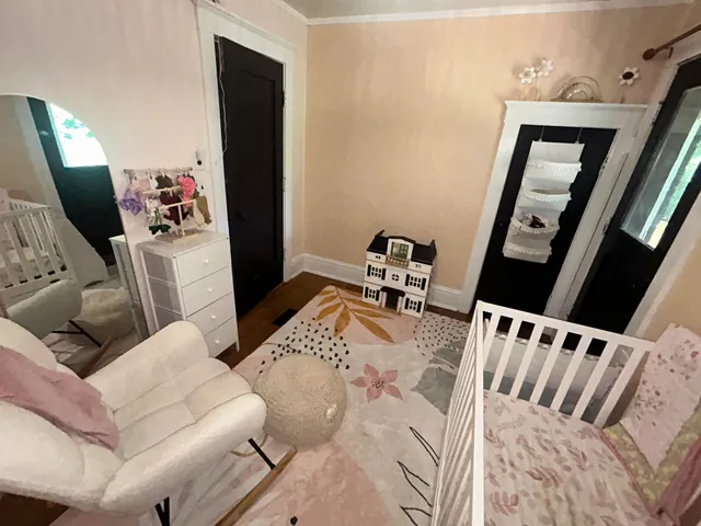 a living room with furniture and mirror