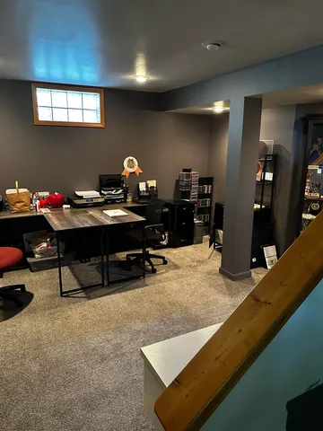 a view of a workspace with furniture