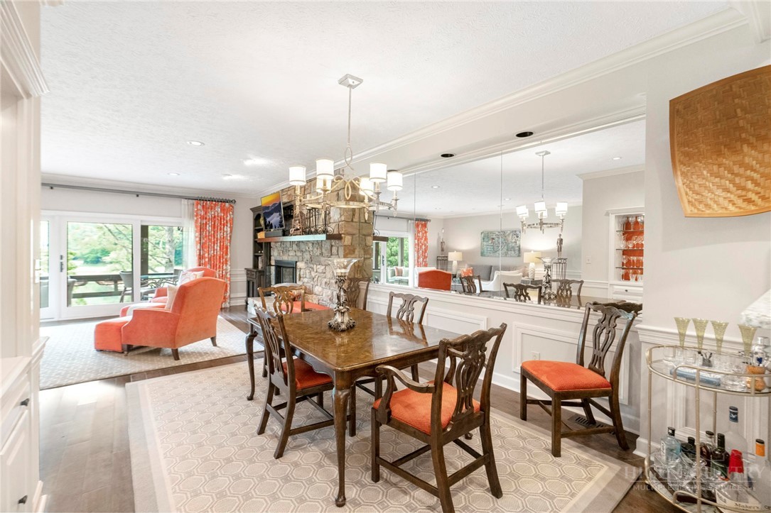 361 The Lakes, Unit C9 Boone, NC 28607 - Photo 9 of 47 a dining room with furniture and a chandelier