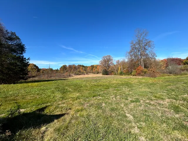 a view of a lake with a yard