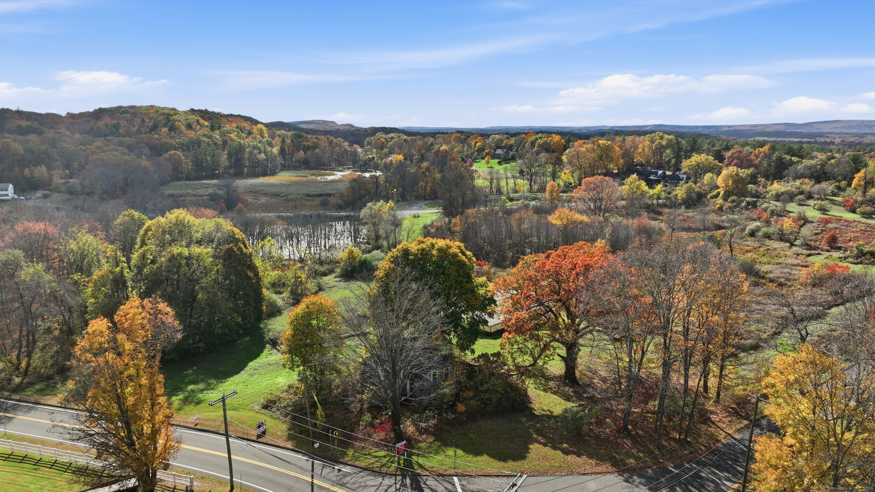 21 Newgate Road East Granby, CT 06026 - Photo 8 of 25 a view of a lake with a mountain in the background