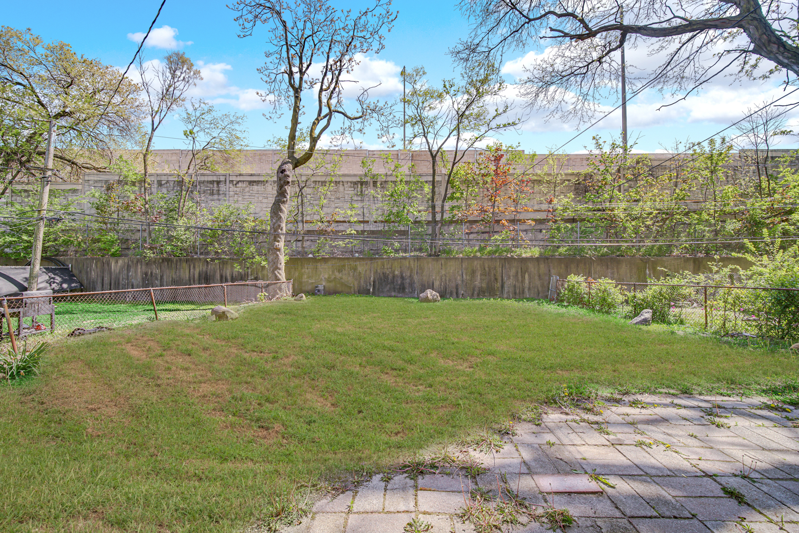 1817 171st Street, Unit 2 Hazel Crest, IL 60429 - Photo 11 of 11 a backyard of a house with lots of green space
