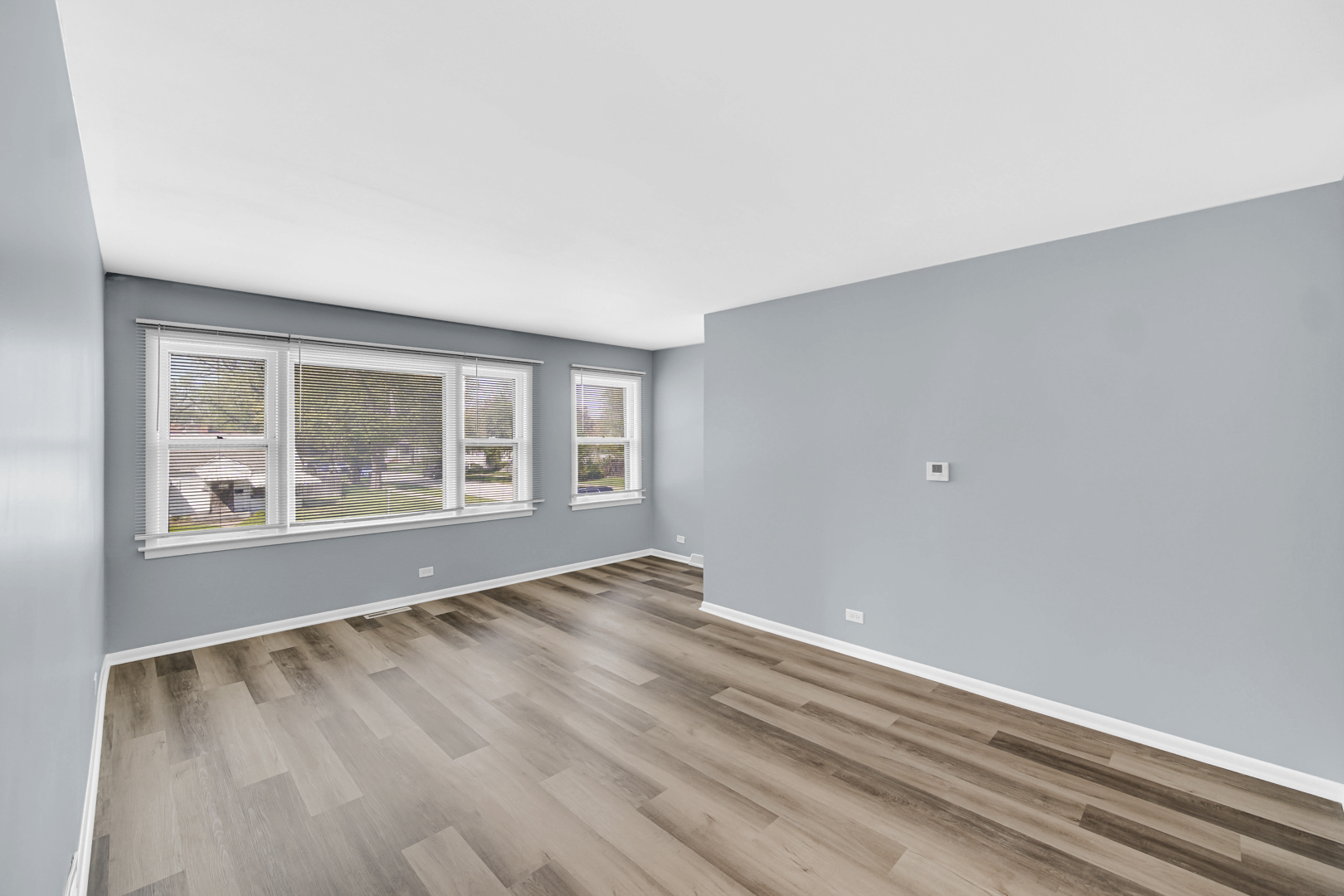 1817 171st Street, Unit 2 Hazel Crest, IL 60429 - Photo 2 of 11 a view of an empty room with a window