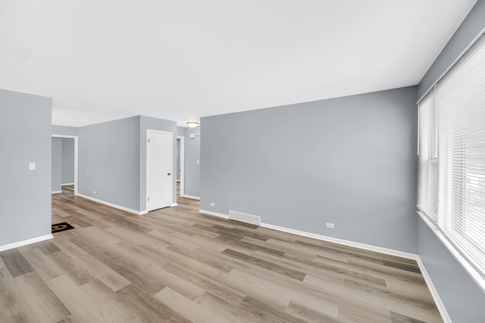 1817 171st Street, Unit 2 Hazel Crest, IL 60429 - Photo 3 of 11 a view of an empty room with a window