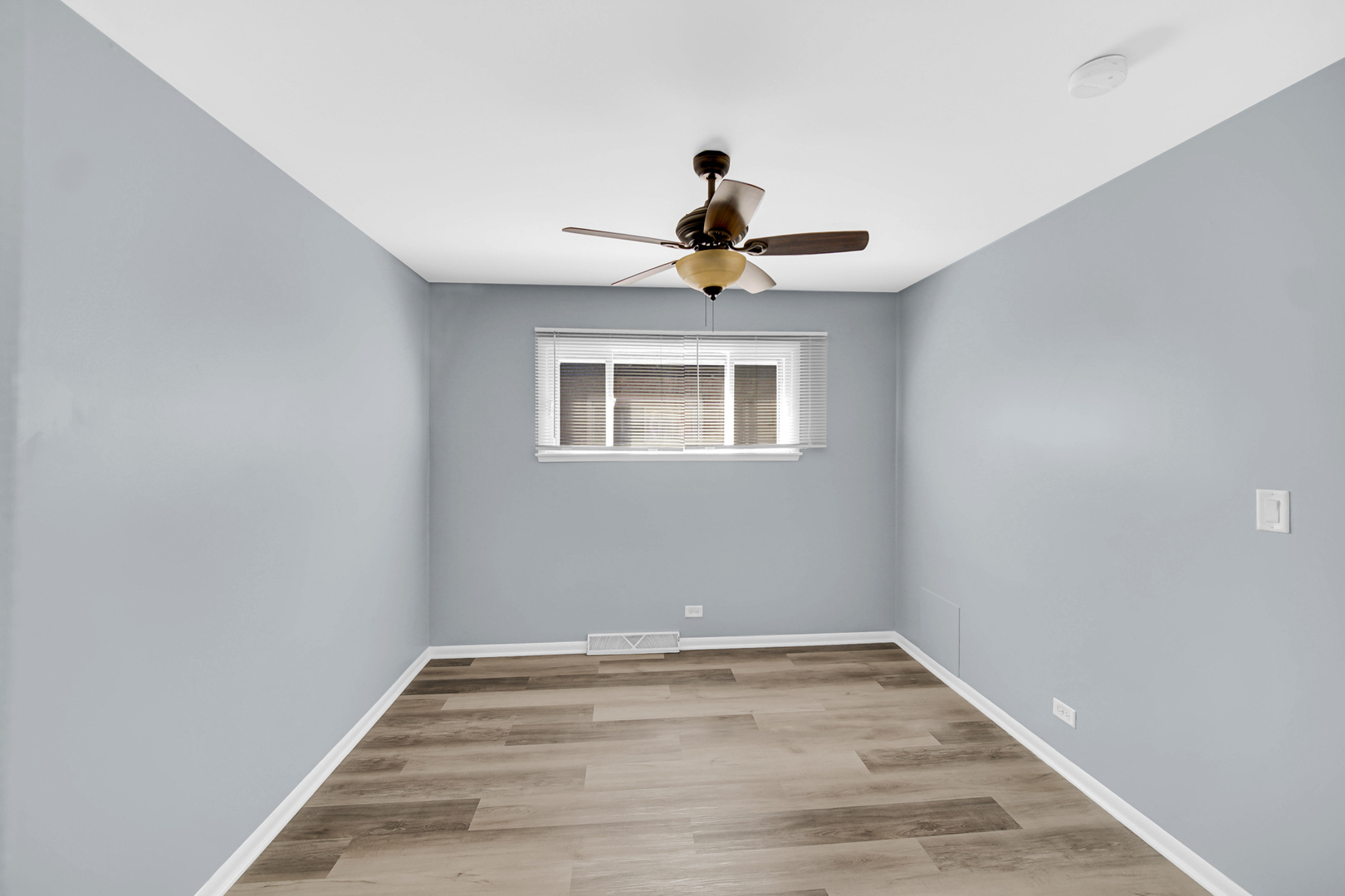1817 171st Street, Unit 2 Hazel Crest, IL 60429 - Photo 6 of 11 a view of a room with wooden floor and windows