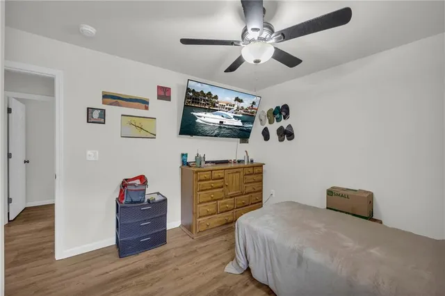 a bedroom with furniture and a chandelier