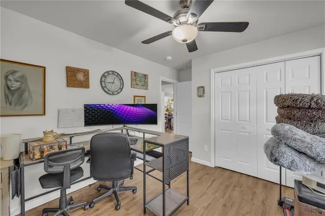 a workspace with furniture and wooden floor