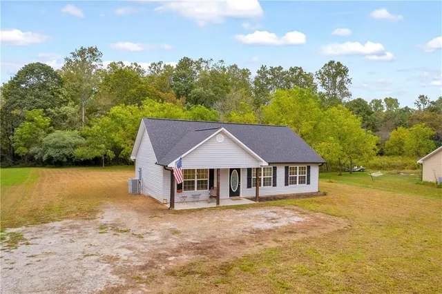 a house with trees in the background