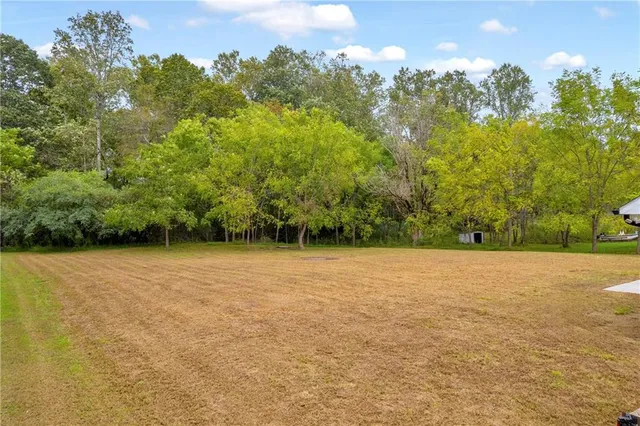 a view of a field with an outdoor space