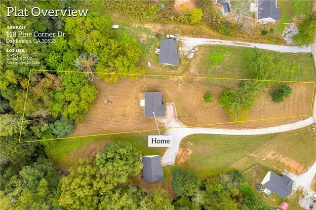 a sign that is sitting in a forest