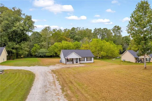 a view of a swimming pool with an outdoor space and seating area