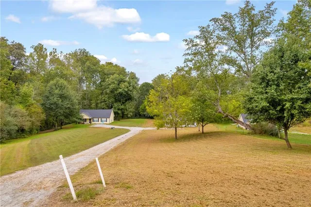 a view of a swimming pool with a yard