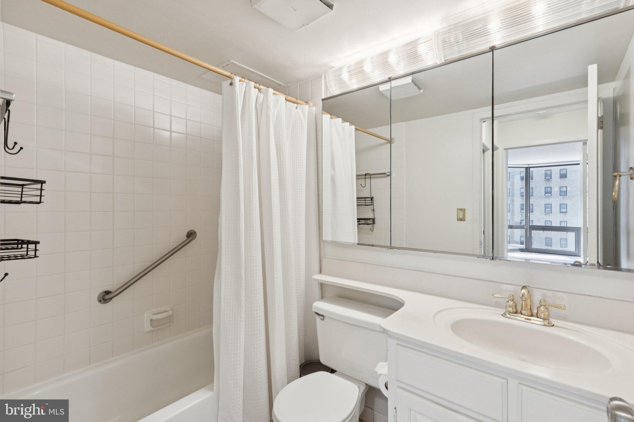 2020 Walnut Street, Unit 14J Philadelphia, PA 19103 - Photo 11 of 25 a bathroom with a sink toilet and shower