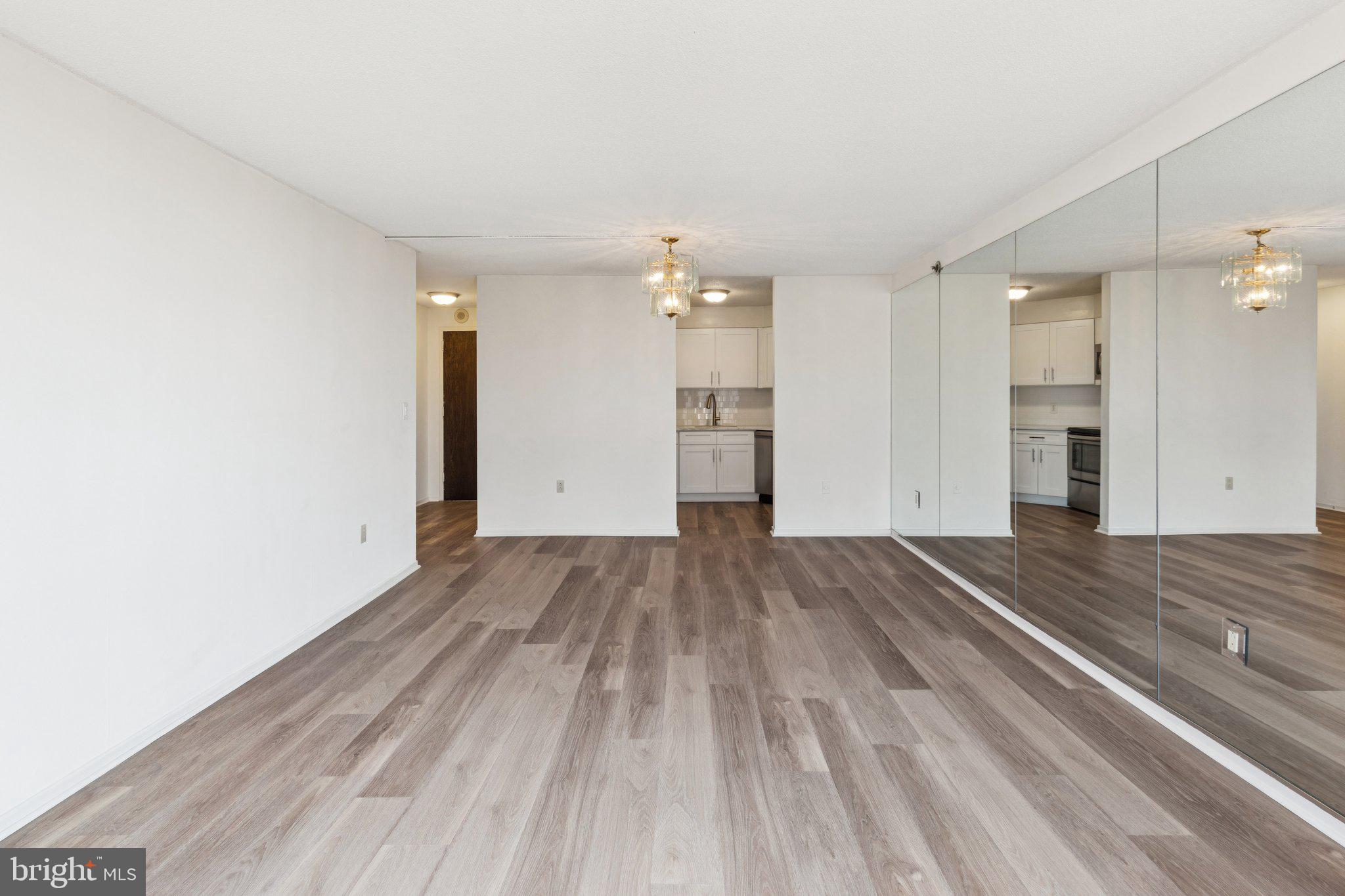 2020 Walnut Street, Unit 14J Philadelphia, PA 19103 - Photo 3 of 25 wooden floor in an empty room with a window