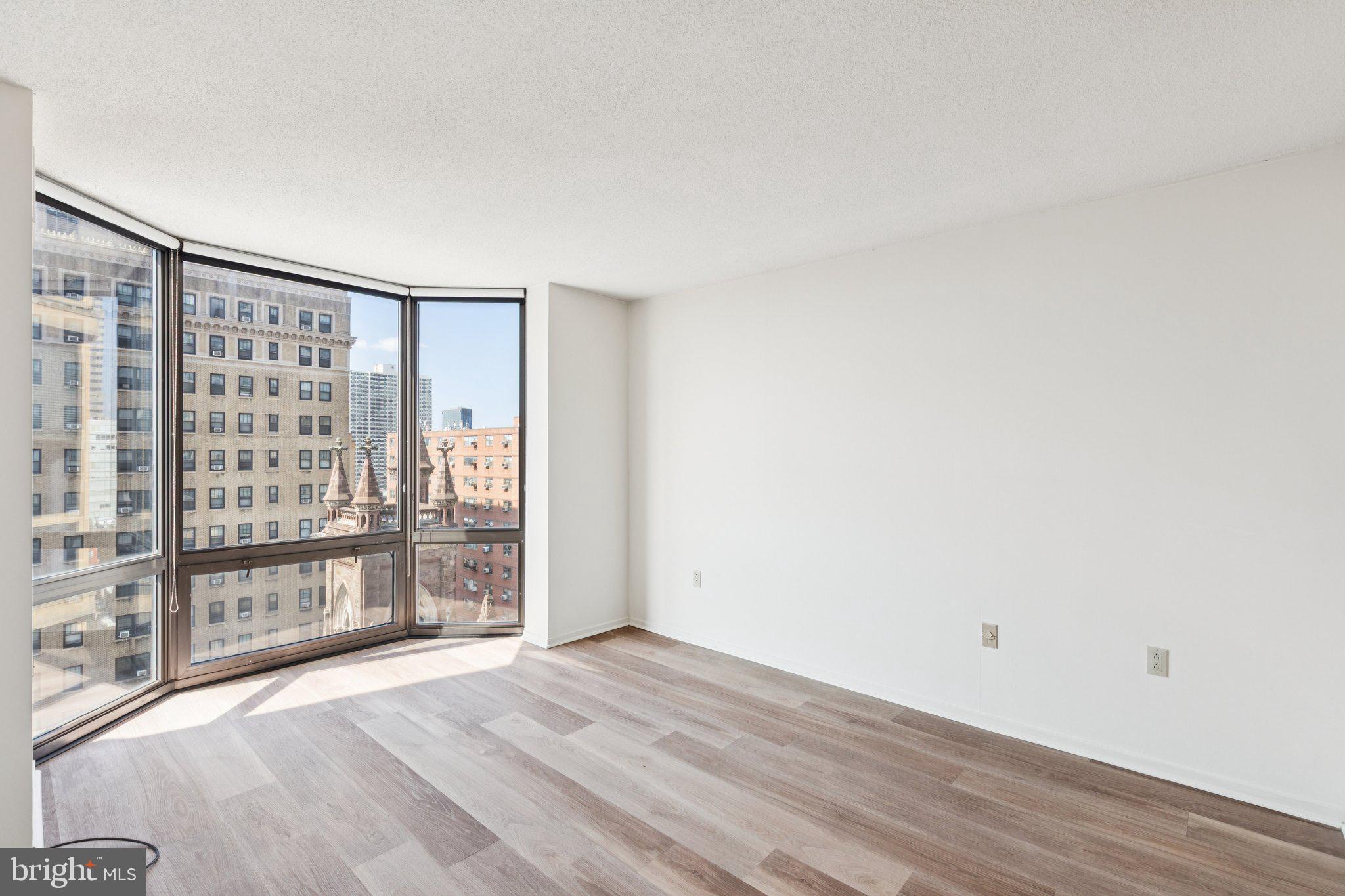 2020 Walnut Street, Unit 14J Philadelphia, PA 19103 - Photo 8 of 25 a view of an empty room with wooden floor