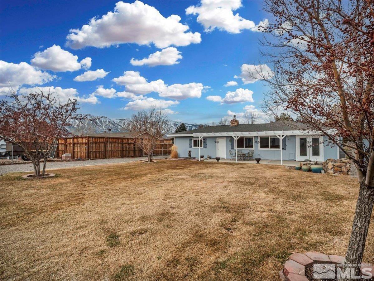 835 Russell Way Gardnerville, NV 89460 - Photo 16 of 40 a front view of a house with a big yard