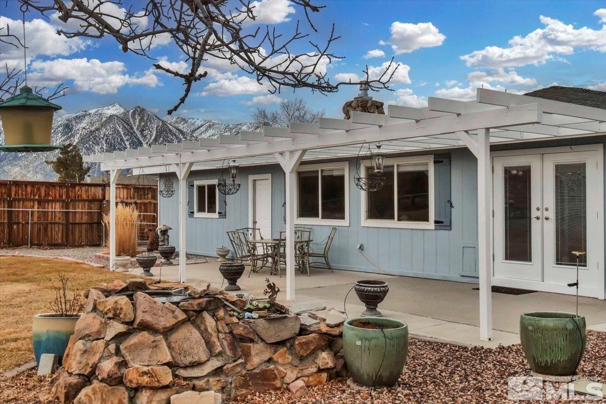 835 Russell Way Gardnerville, NV 89460 - Photo 22 of 40 a front view of a house with patio