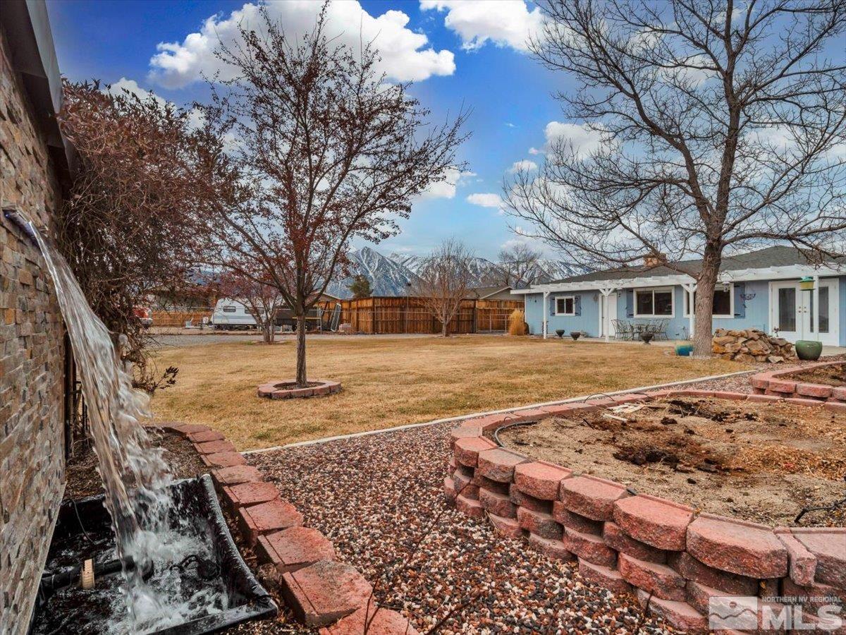 835 Russell Way Gardnerville, NV 89460 - Photo 24 of 40 a front view of a house with a yard