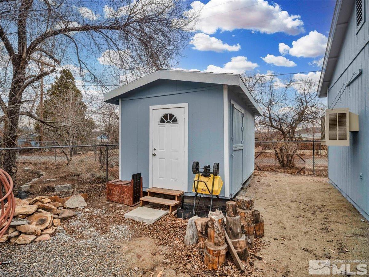 835 Russell Way Gardnerville, NV 89460 - Photo 27 of 40 a house with trees in the background