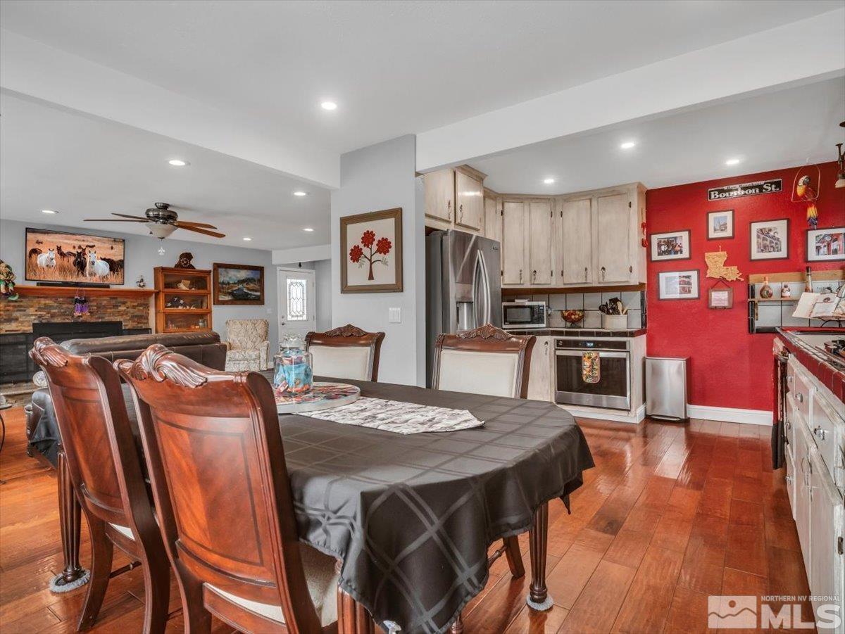 835 Russell Way Gardnerville, NV 89460 - Photo 33 of 40 a view of a dining room with furniture and wooden floor