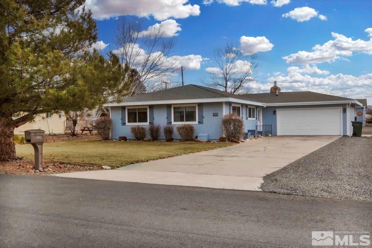 835 Russell Way Gardnerville, NV 89460 - Photo 34 of 40 a front view of a house with a yard