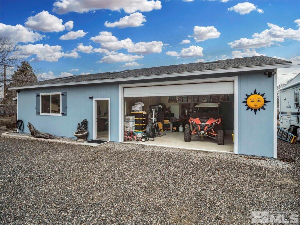 835 Russell Way Gardnerville, NV 89460 - Photo 40 of 40 a view of a garage with a bike and car parked
