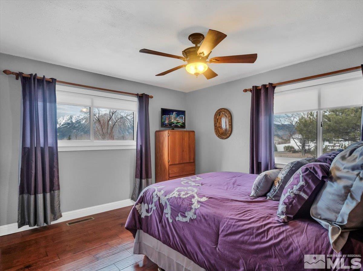 835 Russell Way Gardnerville, NV 89460 - Photo 7 of 40 a bedroom with a bed and a window