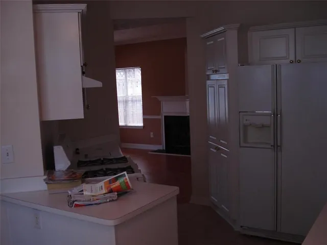 an empty room with wooden floor