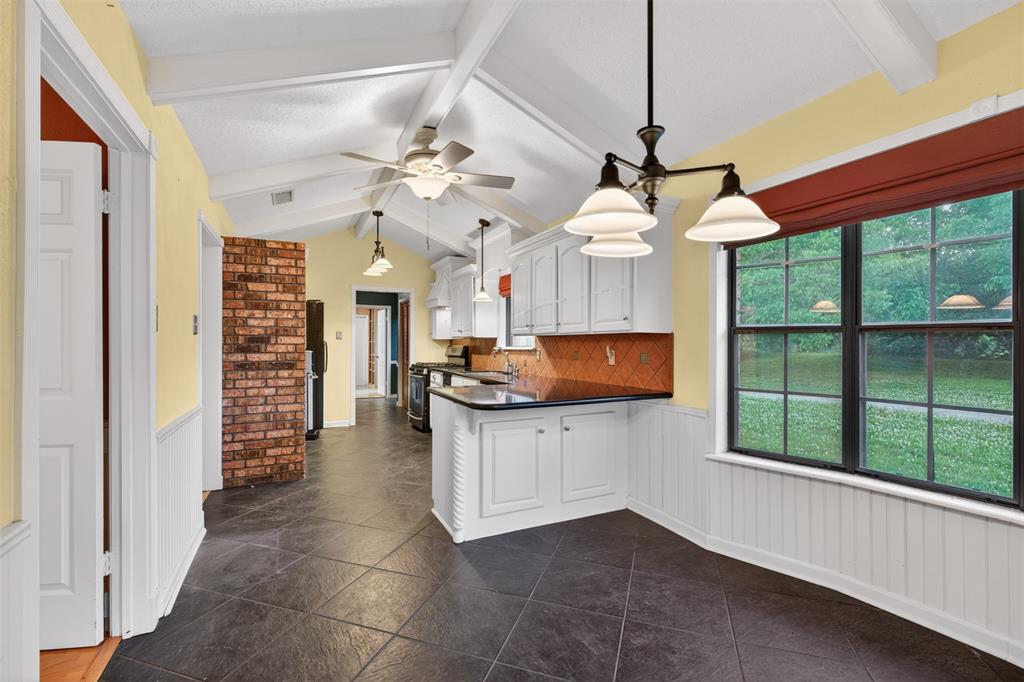401 Cane Bend Drive Haughton, LA 71037 - Photo 6 of 27 a kitchen with stainless steel appliances granite countertop a stove and cabinets