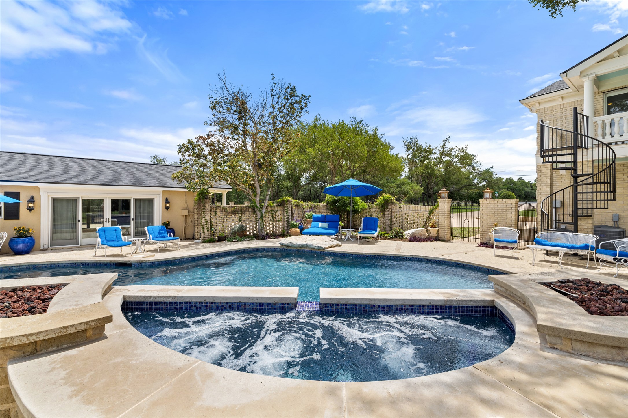 17700 North Rim Drive Leander, TX 78641 - Photo 35 of 38 View of swimming pool featuring an outdoor fire pit, fence, and stairs