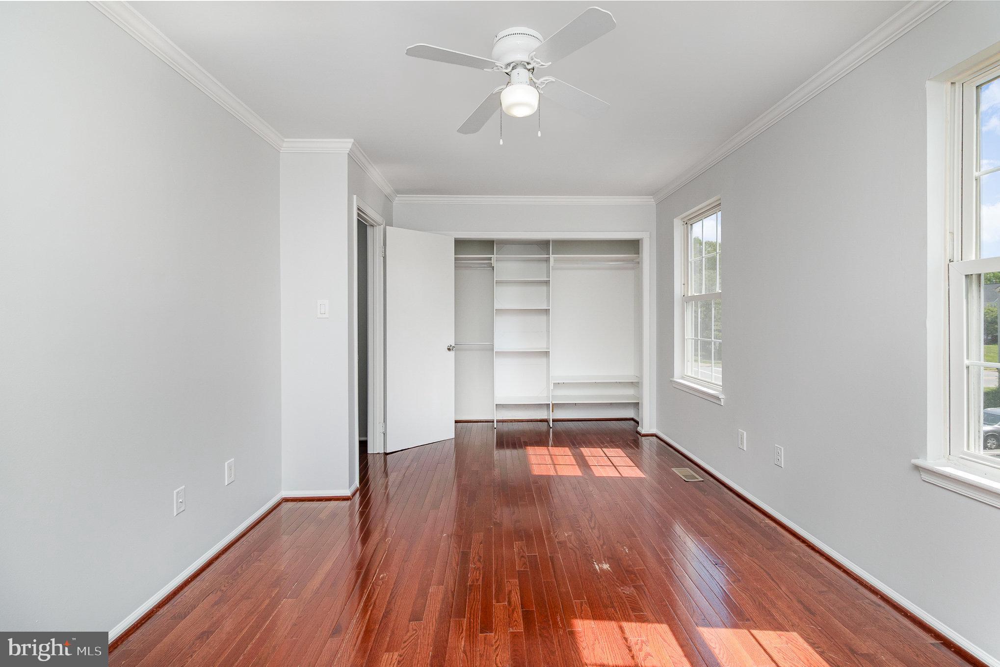 14888 Enterprise Lane Woodbridge, VA 22191 - Photo 11 of 25 wooden floor in an empty room with a window
