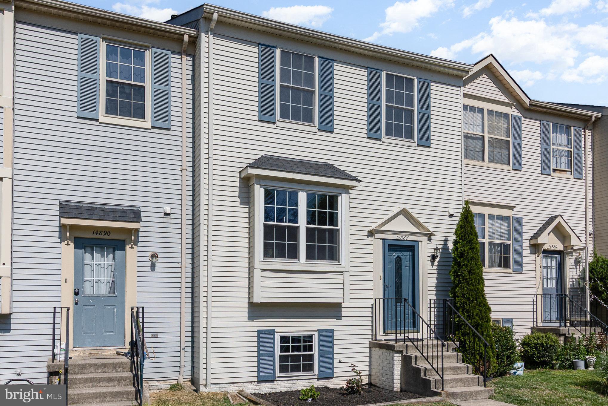 14888 Enterprise Lane Woodbridge, VA 22191 - Photo 2 of 25 a front view of a house with a yard