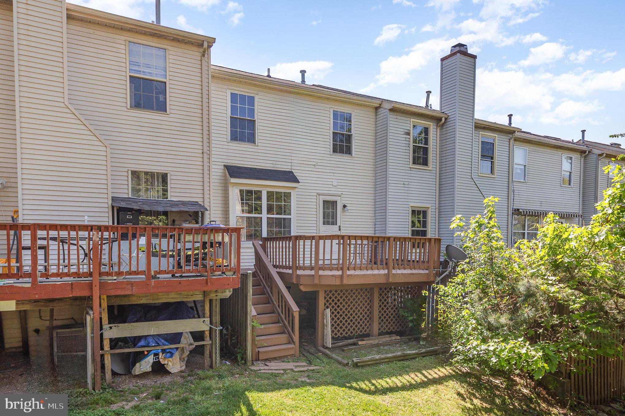 14888 Enterprise Lane Woodbridge, VA 22191 - Photo 21 of 25 a view of a house with backyard porch and sitting area