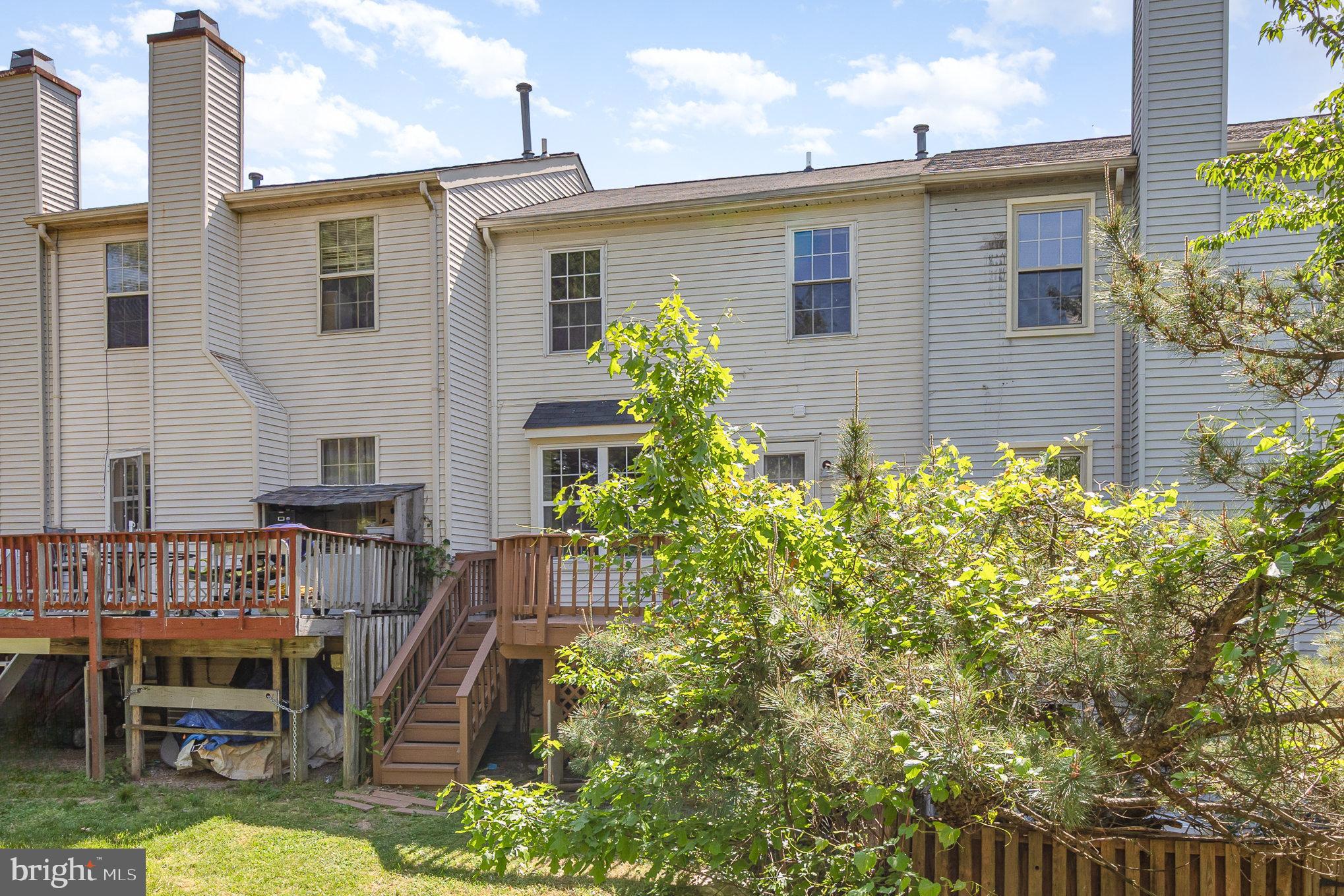 14888 Enterprise Lane Woodbridge, VA 22191 - Photo 22 of 25 a front view of a house with garden