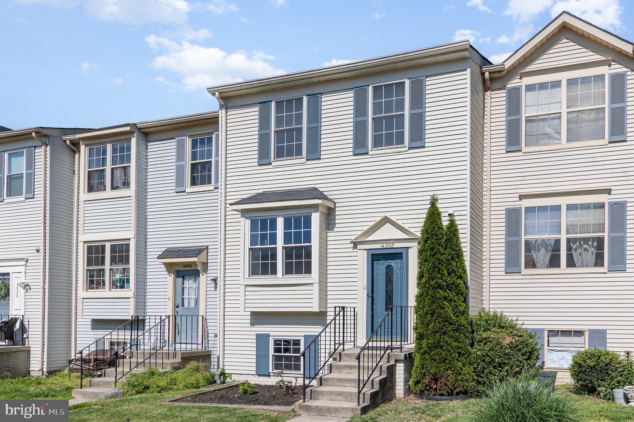 14888 Enterprise Lane Woodbridge, VA 22191 - Photo 3 of 25 a front view of a house with garden