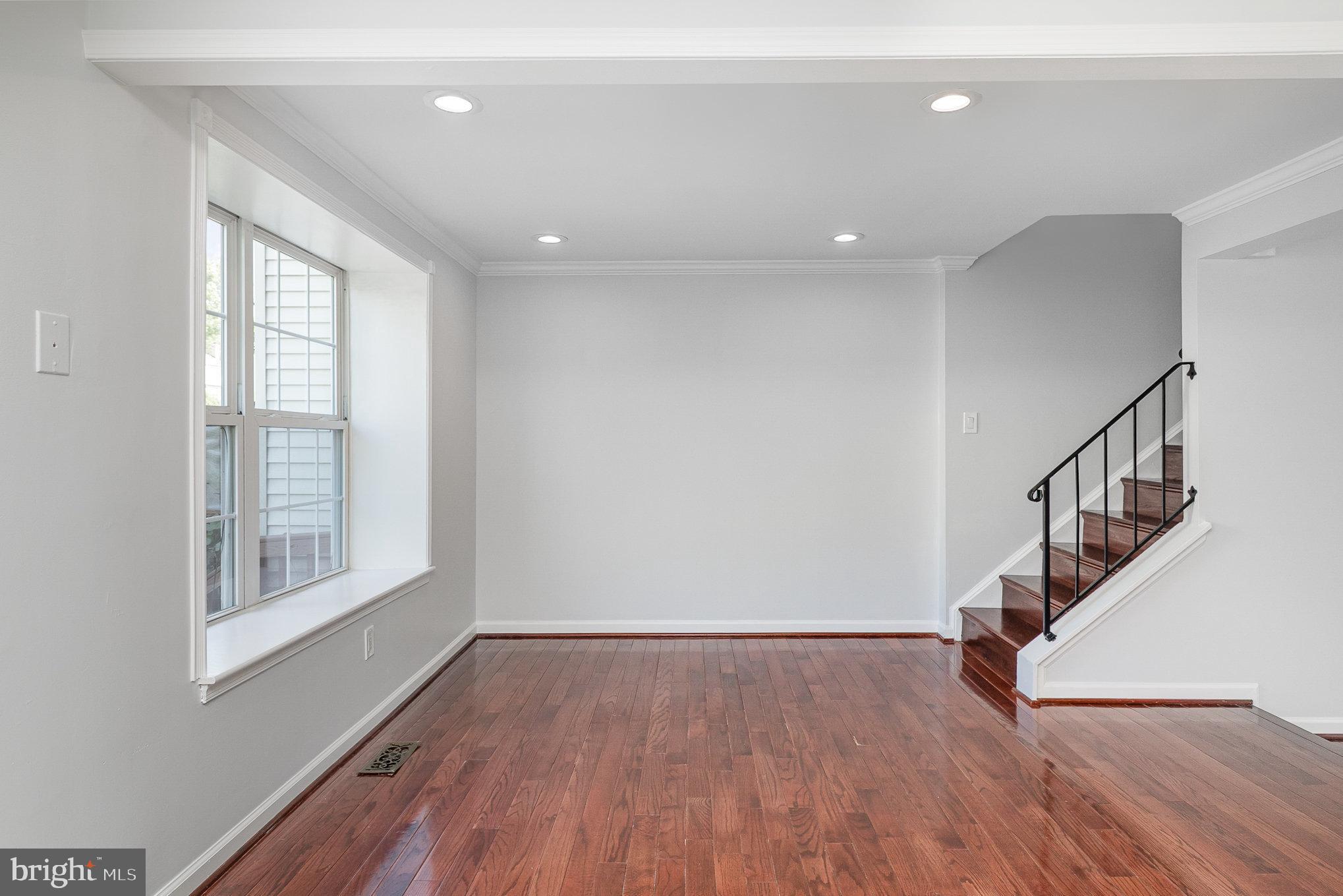 14888 Enterprise Lane Woodbridge, VA 22191 - Photo 6 of 25 a view of entryway with wooden floor and stairs