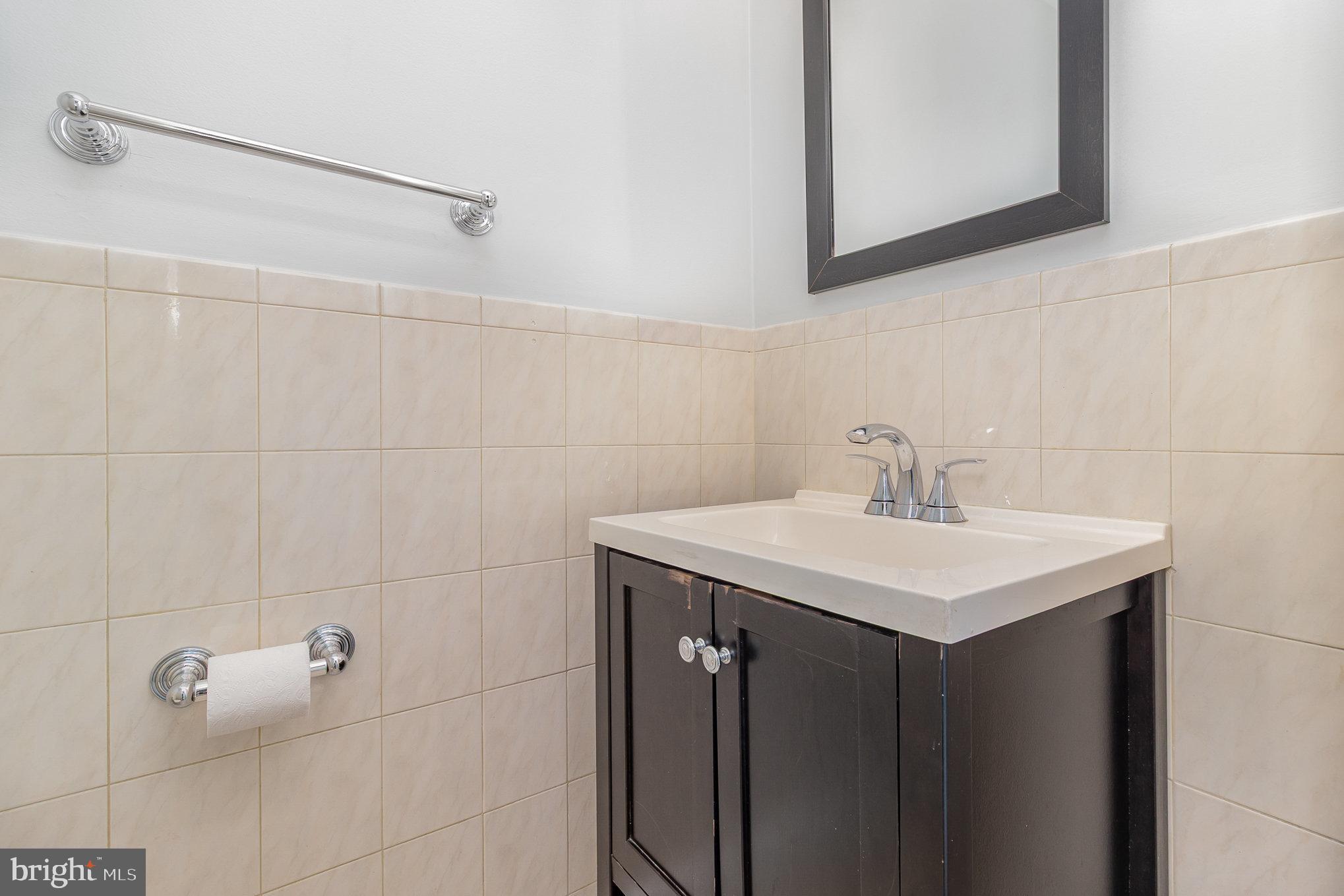 14888 Enterprise Lane Woodbridge, VA 22191 - Photo 9 of 25 a bathroom with a sink and a mirror