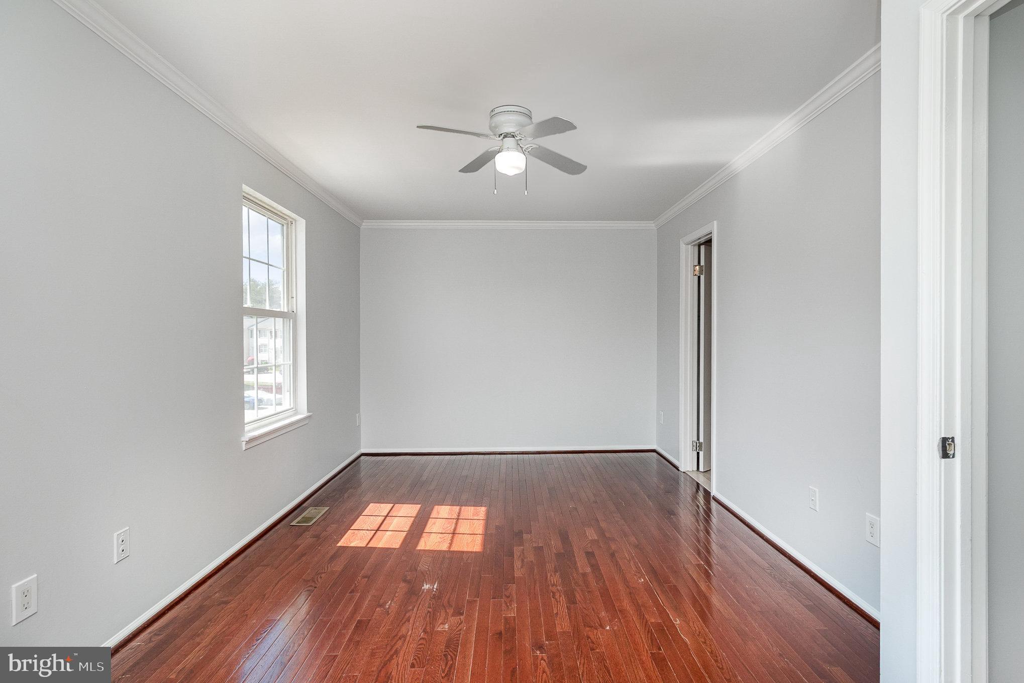 14888 Enterprise Lane Woodbridge, VA 22191 - Photo 10 of 25 wooden floor in an empty room with a window