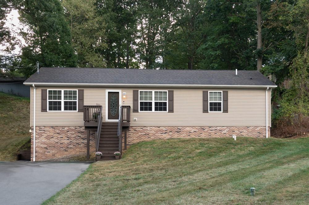 116 Autumn Street Aliquippa, PA 15001 - Photo 1 of 26 a front view of a house with garden